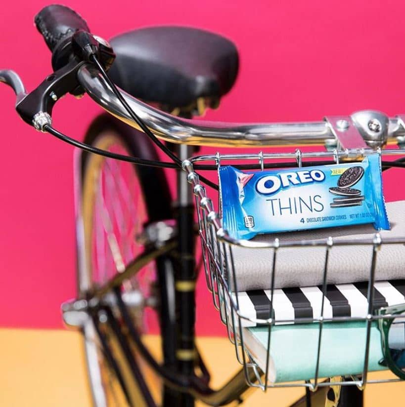 A packet of Oreo Thins in a bicycle basket