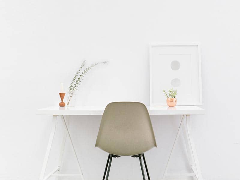 A desk with a chair